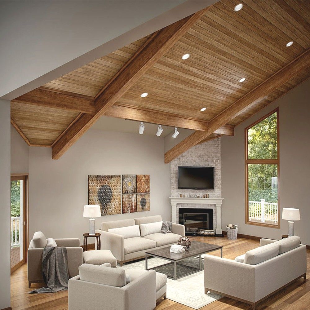 Living room with pot lights and track lighting under a wood beam ceiling